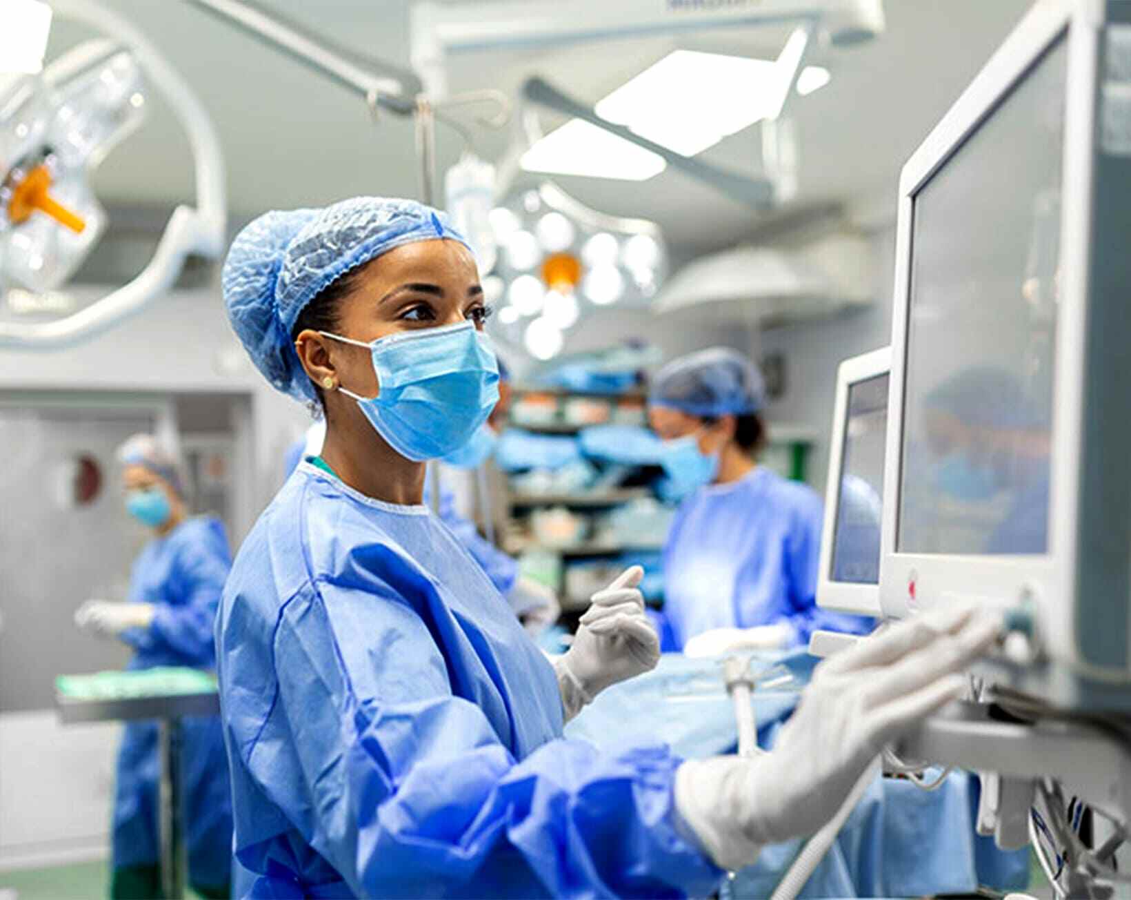 Healthcare professionals in a surgical environment, demonstrating advanced medical technology and patient care