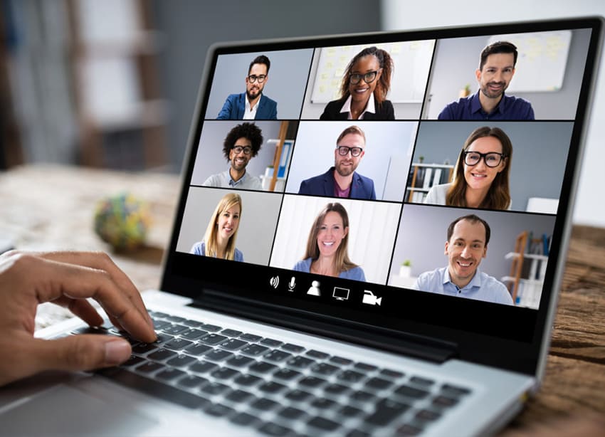 Virtual business meeting with a team on a laptop screen, highlighting remote collaboration and financial planning tools