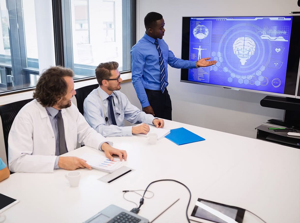 Medical conference with professionals discussing healthcare advancements, presentations, and networking in a modern setting