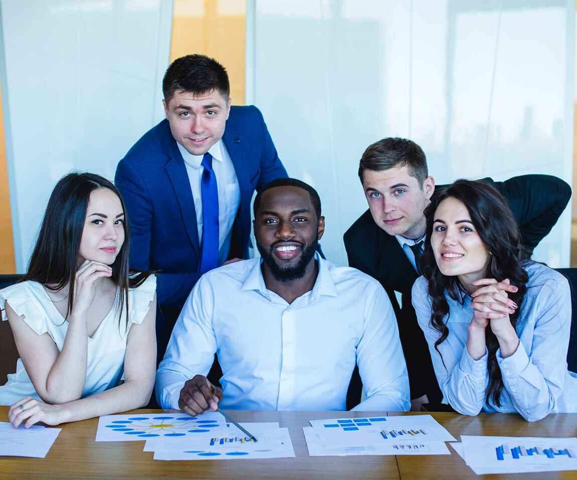 Diverse team collaborating on a project at Bluggle Pvt. Ltd., showcasing teamwork and corporate culture